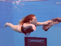FuckingChickas presents: Curly red hair girl swims in her panties